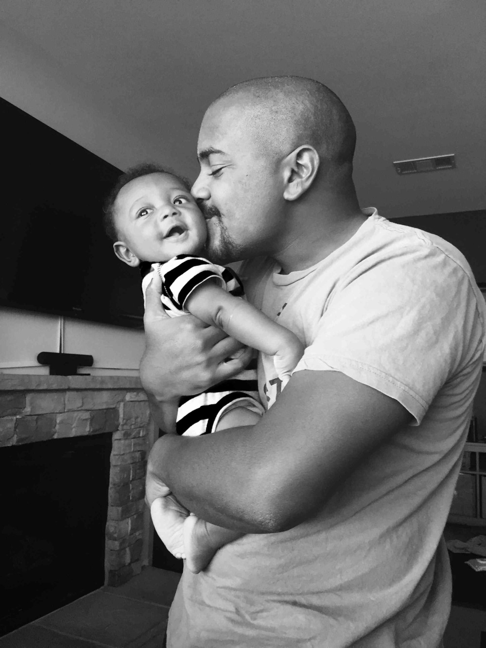 Roshan holding his child
